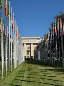 Flags line the pathway to the United Nations building in Geneva, Switzerland on a sunny day.